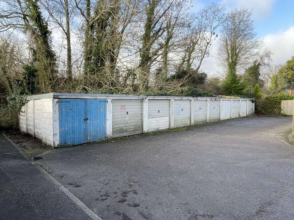 Lot: 109 - TEN GARAGES AND FORECOURT IN VILLAGE LOCATION - Ten garages in village